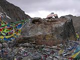 Tibet Kailash 09 Kora 08 Dolma Rock on Dolma La The surfaces of the D�lma Do (D�lma�s Rock) are inscribed with mantras in yellow and red. When Gotsangpa wandered into the valley of Dakini Khadroma, he was led back to the correct route by 21 wolves that were 21 emanations of D�lma (Tara), the goddess of mercy and protectoress of the pass. Reaching the pass, the 21 wolves merged into one and then merged again into the great rock.